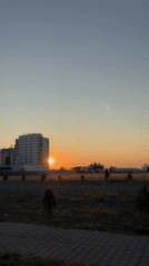 Golden sunset light over Năvodari's modern residential streetscape