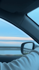 Driver travels scenic waterside route in Chaikovsky, Russia