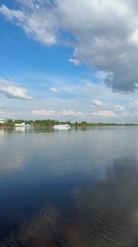 Family enjoys afternoon at Volga River beach in Yaroslavl