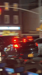 Night traffic stop with ambulance siren in Manhattan