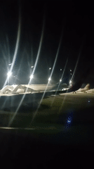 Aircraft parked on runway captured at Kuta airport