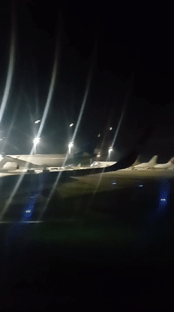 Aircraft parked on runway captured at Kuta airport