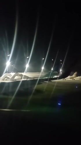 Aircraft parked on runway captured at Kuta airport