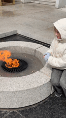 Girl visits Eternal Flame memorial in Veliky Novgorod