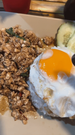 Traditional Thai rice dish with fried egg documented in Ratsada