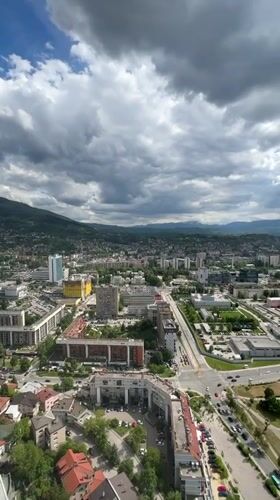 Tourist captures selfies at Sarajevo observation deck overlook