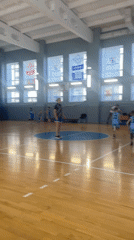 Youth basketball team practices in Samara indoor court