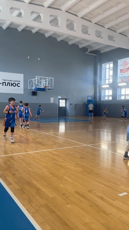 Youth basketball team practices in Samara indoor court