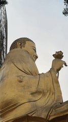 Visitor films Buddhist temple statues and gardens in Đà Lạt