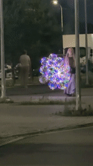 Glowing balloons light up a nighttime Astana walkway