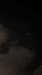 Helicopter and aircraft activity over Tel Aviv beachfront at night
