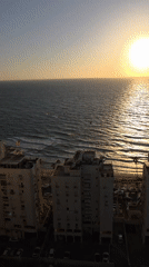 Kitesurfers enjoy golden hour session off Bat Yam coast