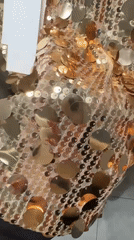 Person films sequined outfit try-on in Esenyurt mirror selfie