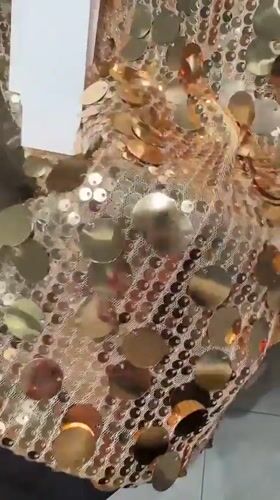 Person films sequined outfit try-on in Esenyurt mirror selfie