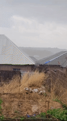 Rainfall captured filling water tank in Jos, Nigeria