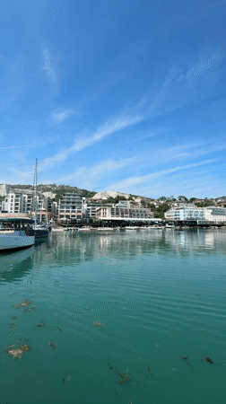 Tourist documents sunny marina views in Balchik, Bulgaria