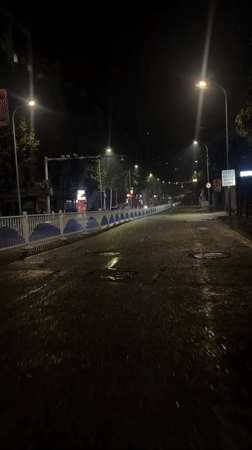 Rain-soaked streets documented across two Chongqing districts Friday evening