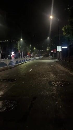 Rain-soaked streets documented across two Chongqing districts Friday evening