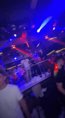 Late-night club scene in Smolyan under colored lights