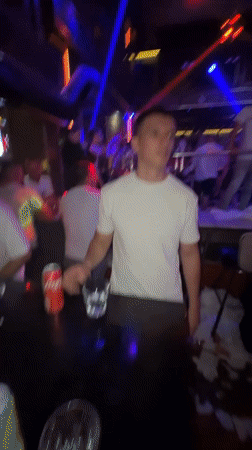 Late-night club scene in Smolyan under colored lights