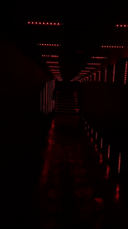 Red-lit tunnel hallway captured in Playa del Carmen
