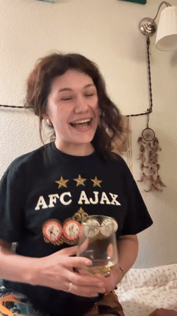 Casual evening indoors in Kudrovo, AFC Ajax shirt in frame