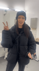 Woman takes mirror selfies in Berlin public restroom