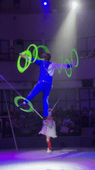 Circus performer juggles while balancing on tightrope in Moscow