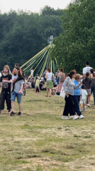 Outdoor gathering near a colorful spinning structure in Sofia