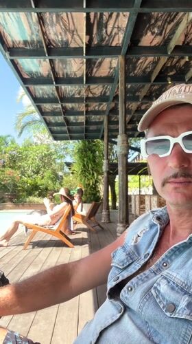 Quiet poolside gathering documented in Petulu, Indonesia