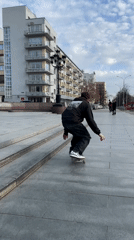 Skateboarder practices tricks in Yekaterinburg public square
