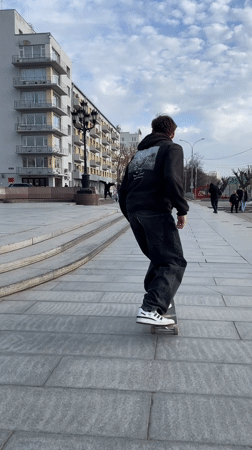 Skateboarder practices tricks in Yekaterinburg public square