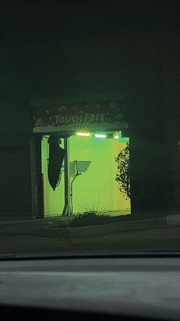 Naperville car wash displays colorful lighting sequence during nighttime operation