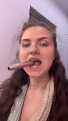Woman applies makeup indoors in Russia