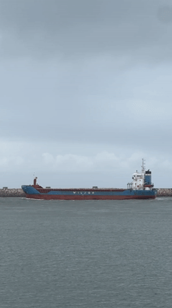 Overcast day maritime activity captured at Gafanha da Nazaré beach