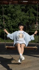 Woman enjoys leisurely morning at Kazan park playground