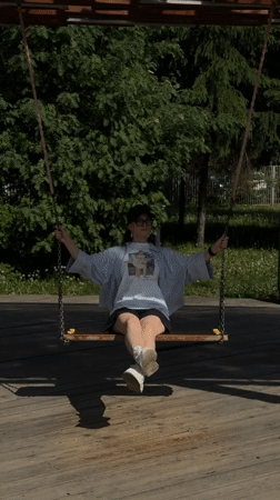 Woman enjoys leisurely morning at Kazan park playground