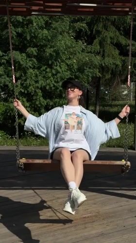 Woman enjoys leisurely morning at Kazan park playground