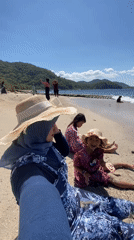 Family enjoys sunny beach day in Indonesia