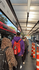 Commuters queue at Mexico City bus stop