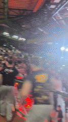 Arm-wrestling competitors embrace after match in Wuppertal arena