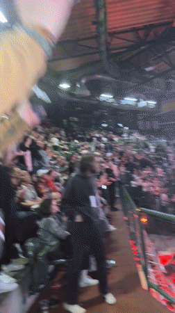 Arm-wrestling competitors embrace after match in Wuppertal arena