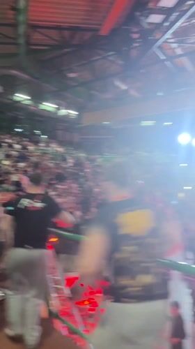 Arm-wrestling competitors embrace after match in Wuppertal arena