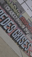 Graffiti art documented at Barcelona skatepark near industrial chimneys