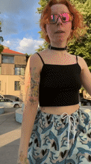 Woman dances in Belgrade plaza wearing distinctive outfit