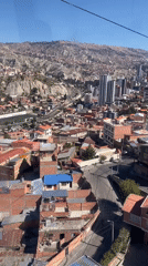 Cable car passenger films La Paz cityscape from above