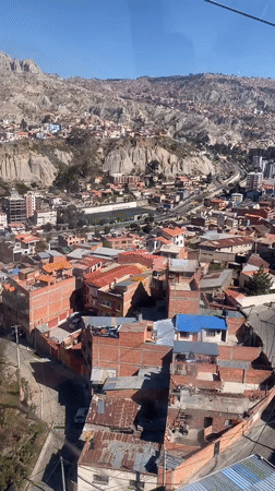 Cable car passenger films La Paz cityscape from above