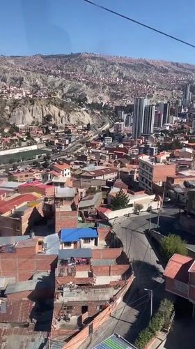 Cable car passenger films La Paz cityscape from above