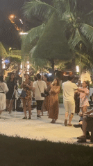 Nighttime public gathering draws 20 people to illuminated square