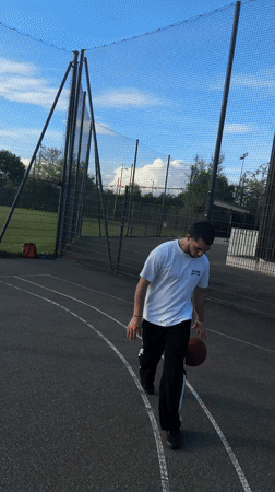 Young men play casual basketball in Strasbourg park